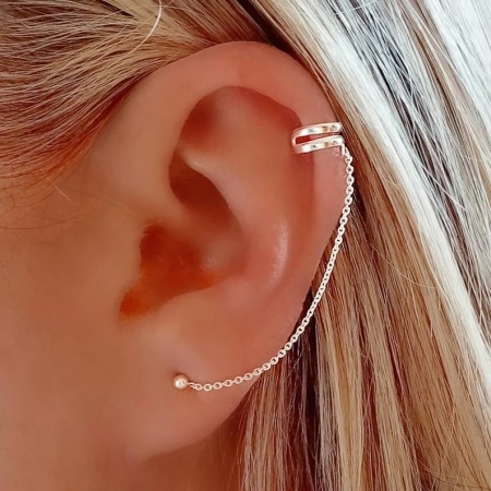 Sterling silver double-line ear cuff with a chain.